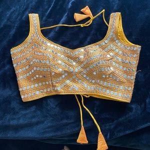 Brand New beautiful blouse that can be teamed up with Saree/Lehnga in size 38 in